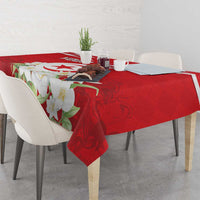 Red tablecloth corner with jasmine blossoms and Tunisian emblem design