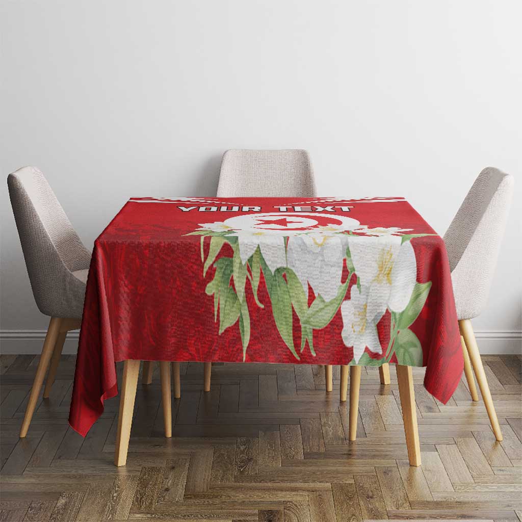 Red tablecloth showing “YOUR TEXT” and jasmine flowers on dining table