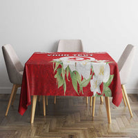 Red tablecloth showing “YOUR TEXT” and jasmine flowers on dining table