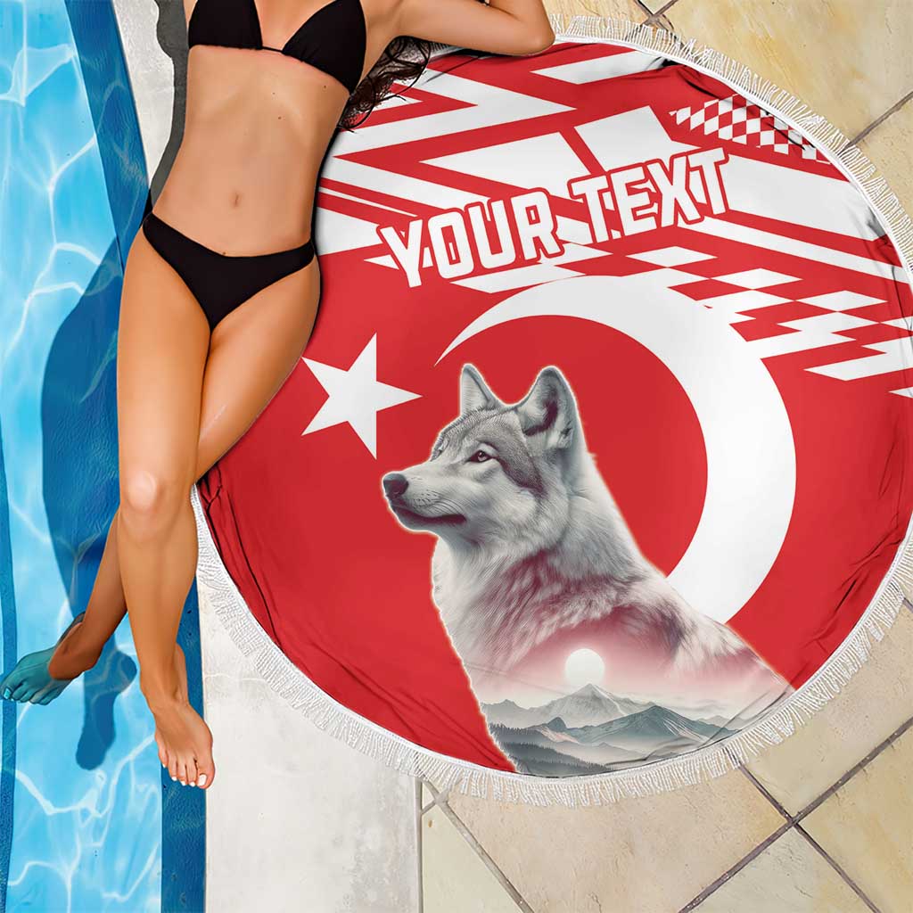 Round red and white beach blanket showing gray wolf portrait, YOUR TEXT, and fringed edge