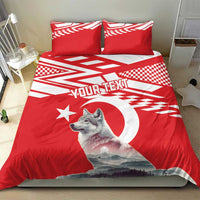 Personalized bedding set on bed: red duvet with wolf graphic, star detail, and “YOUR TEXT”