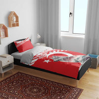 Personalized red bedding set on dark bed frame, featuring wolf graphic and “YOUR TEXT”
