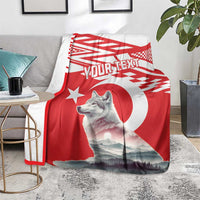 Red personalized wolf and Turkey flag style blanket on living room sofa