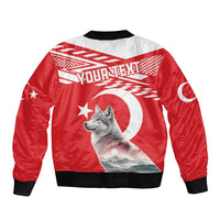 Red bomber jacket with black collar and cuffs, wolf graphic, crescent-and-star sleeve patch