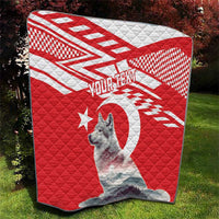 Red and white quilt with gray wolf portrait, star and circle motif, quilted pattern
