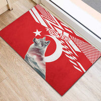 Personalized red rubber doormat on floor with wolf, moon, and 'YOUR TEXT'