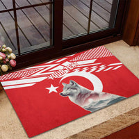 Personalized red rubber doormat on porch with wolf, moon, and 'YOUR TEXT'