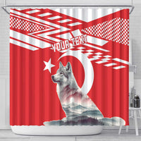 Red shower curtain with gray wolf portrait, crescent, star, and bold geometric print
