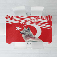 Personalized red tablecloth with check trim, wolf graphic, and “your text” area