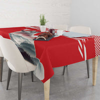 Red personalized tablecloth draped over a table, showing mountain landscape print