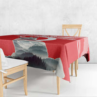 Red personalized tablecloth with mountain print and check pattern edging