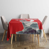 Red personalized mountain tablecloth on a dining set with chairs at both sides