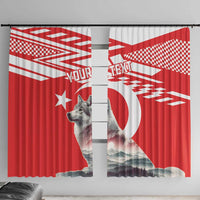 Red and white window curtain with wolf graphic, mountains, and custom text