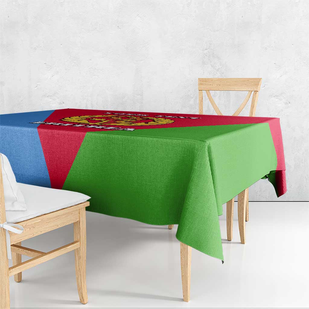 Eritrea flag-color tablecloth draped over table in red, blue, and green.
