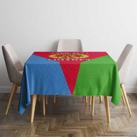 Eritrea flag-color tablecloth with central emblem, red/blue/green, on dining table.