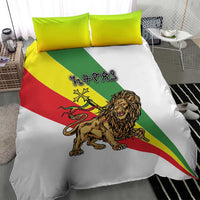 Ethiopian bedding set close-up: white duvet with diagonal flag stripes and lion emblem