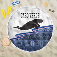 Round beach blanket with Cabo Verde text, black manatee, blue patterned border and fringe