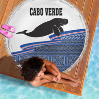 Round beach blanket with Cabo Verde text, black manatee, blue geometric stripe pattern and fringe