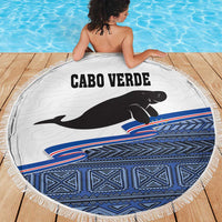 Round beach blanket with Cabo Verde text and black manatee, blue geometric band and tassel fringe