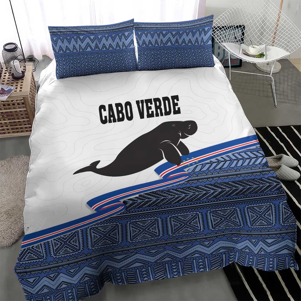 Cabo Verde manatee bedding set with blue geometric border and two matching square shams