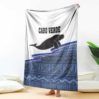 Cape Verde manatee blanket draped, white with blue geometric bands and CABO VERDE text