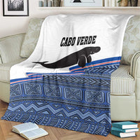 Cape Verde manatee blanket, folded white top with black manatee and blue geometric border