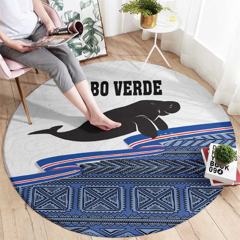 Round area rug with manatee silhouette and Cabo Verde text, blue geometric band border