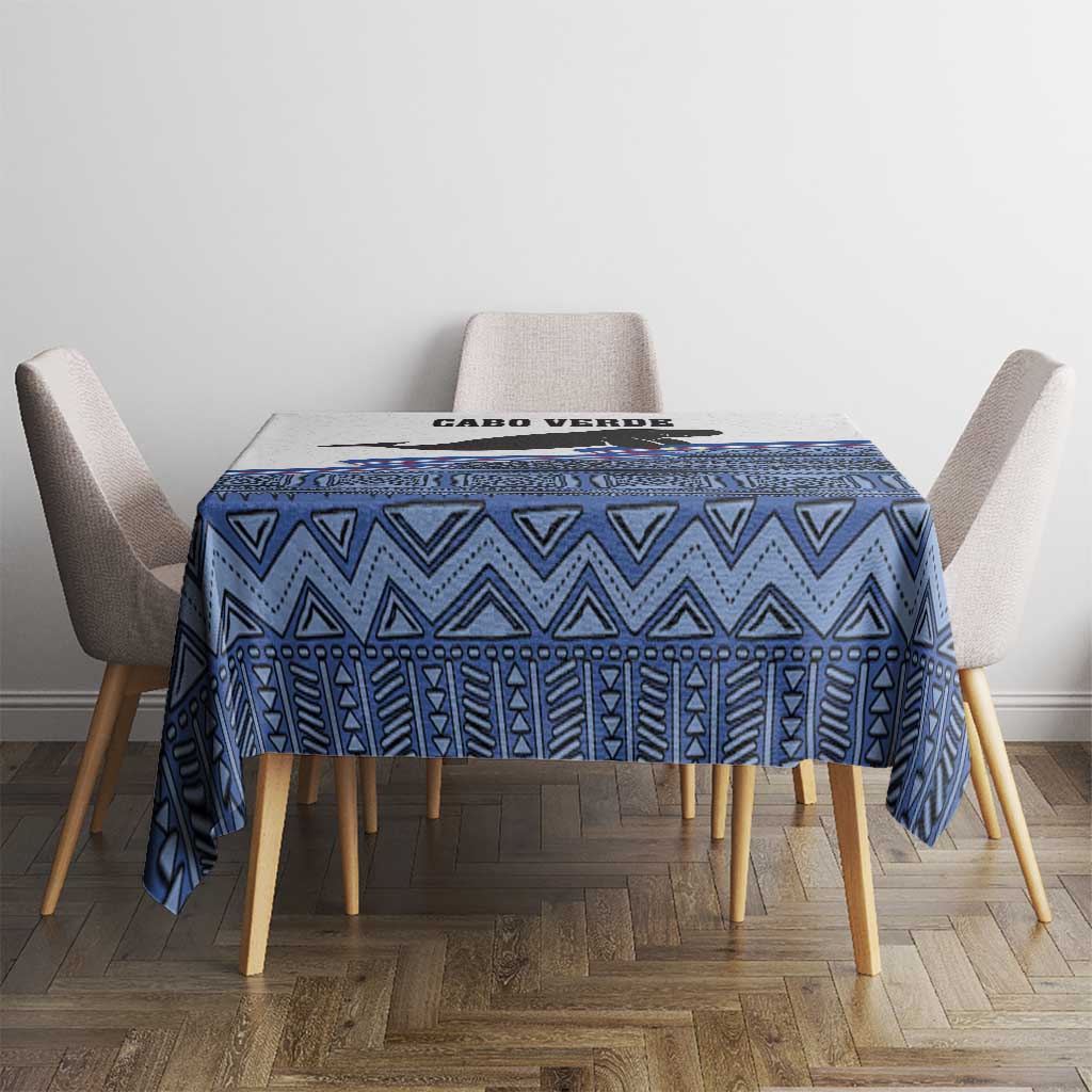 Blue geometric tablecloth on dining table with CABO VERDE print