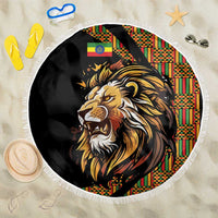 Round black beach blanket with lion face artwork and fringed white edge