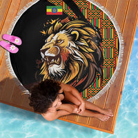 Round black beach blanket with lion graphic, colorful patterned border, fringed edge