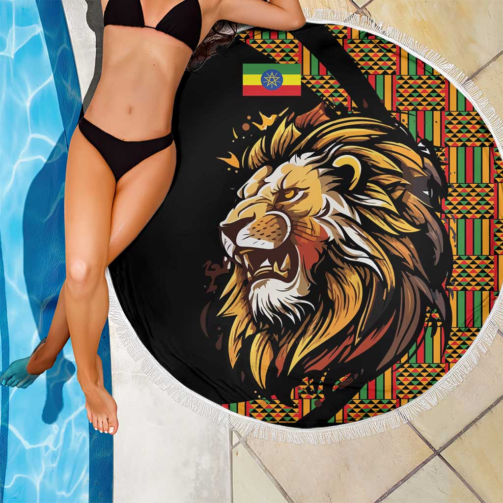 Round black beach blanket with lion face print, colorful border, white fringe trim