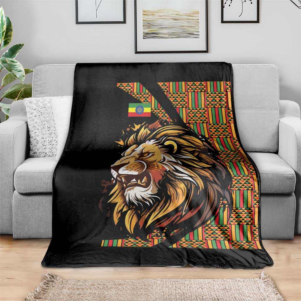 Black lion graphic throw blanket with colorful Ethiopian-style striped border