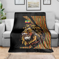 Black lion graphic throw blanket with colorful Ethiopian-style striped border