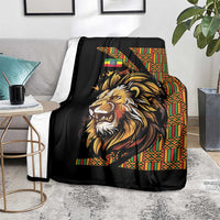 Black lion throw blanket with colorful Ethiopian-style stripe border, hanging on chair
