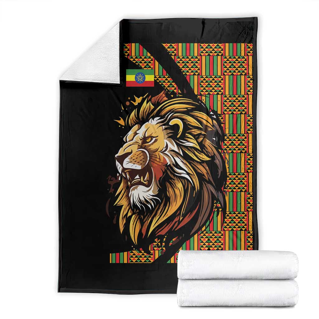 Black lion-pattern blanket with colorful Ethiopian-striped border, folded set