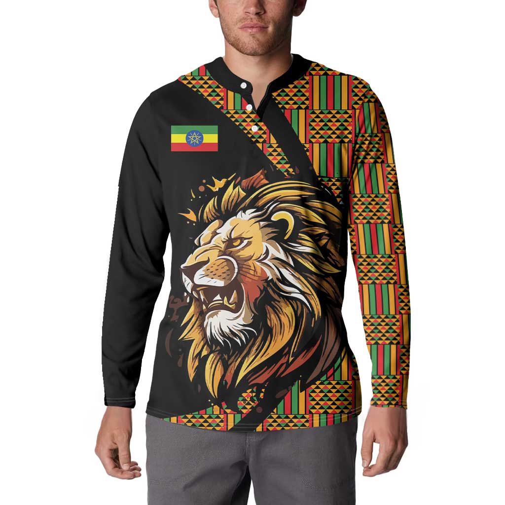 Black button sweatshirt worn by model, lion chest graphic and striped colorful panels
