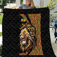 Black quilt with quilted diamond pattern and colorful lion graphic