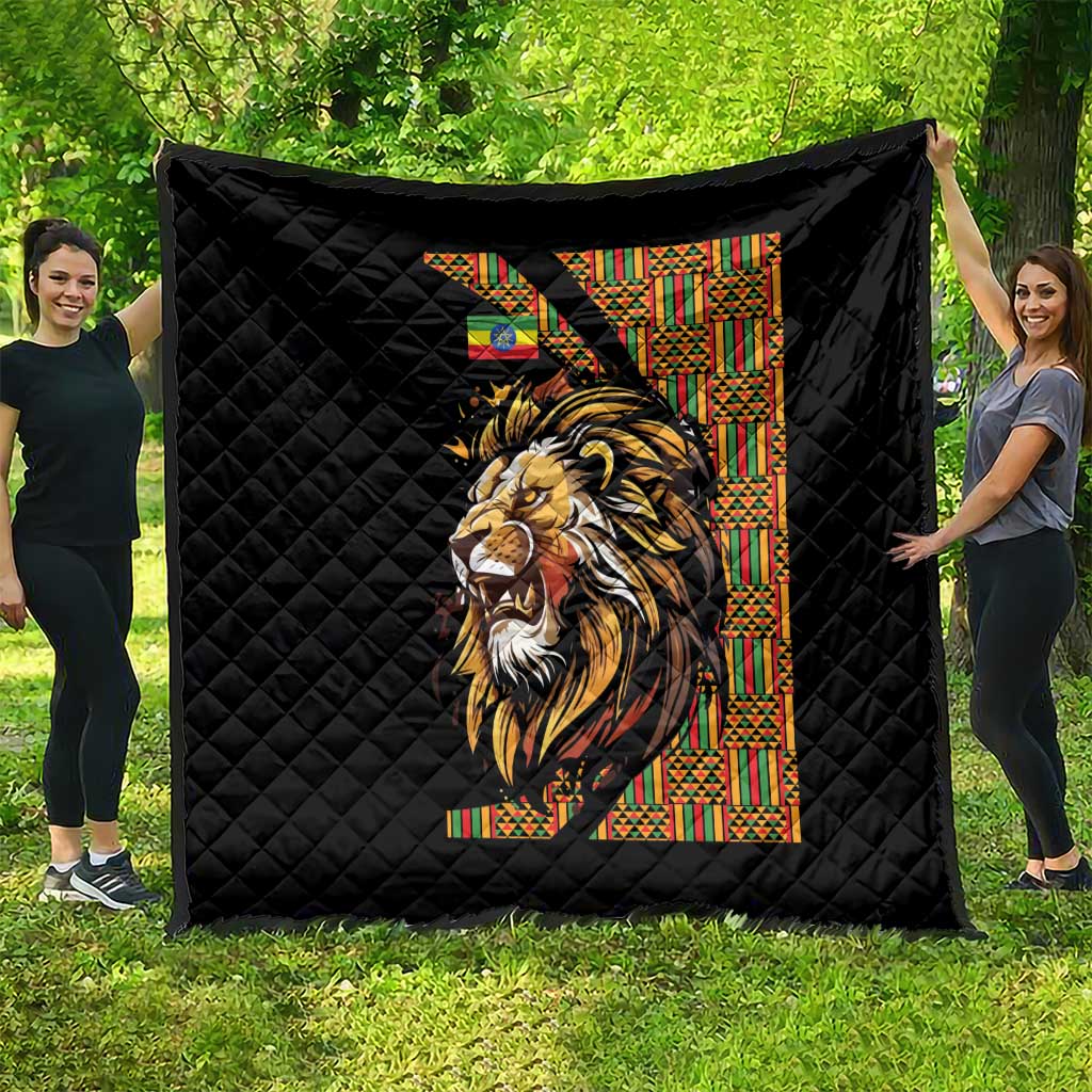 Black quilt with diamond quilting and colorful lion print beside patterned column