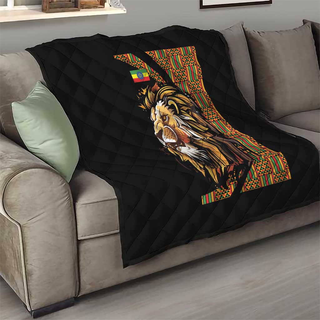 Black quilt with diamond quilting and lion face print with colorful geometric border