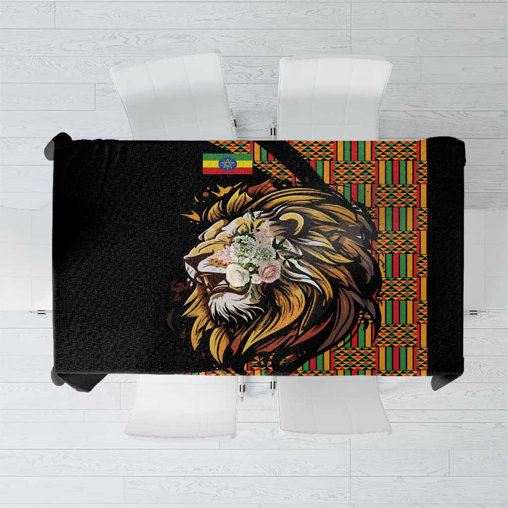 Black tablecloth with golden lion head and colorful Ethiopian-style border pattern