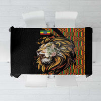 Black tablecloth with golden lion head and colorful Ethiopian-style border pattern
