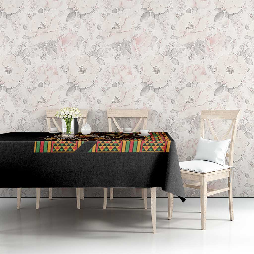 Black tablecloth with colorful geometric trim and lion artwork on a dining table