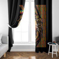 Black window curtain with partial lion print near window, draped curtain panels