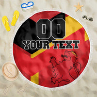 Round beach blanket with Spain flag design, lion emblem, and custom text, white fringe