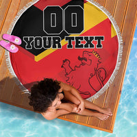Round beach blanket showing Spain flag red-yellow with lion and custom text, tassel fringe