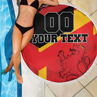 Fringed round beach blanket over a swimmer, Spain flag with lion and custom text