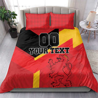 Red Spain-themed bedding set with yellow shield stripe, lion crest, and two red pillowcases.