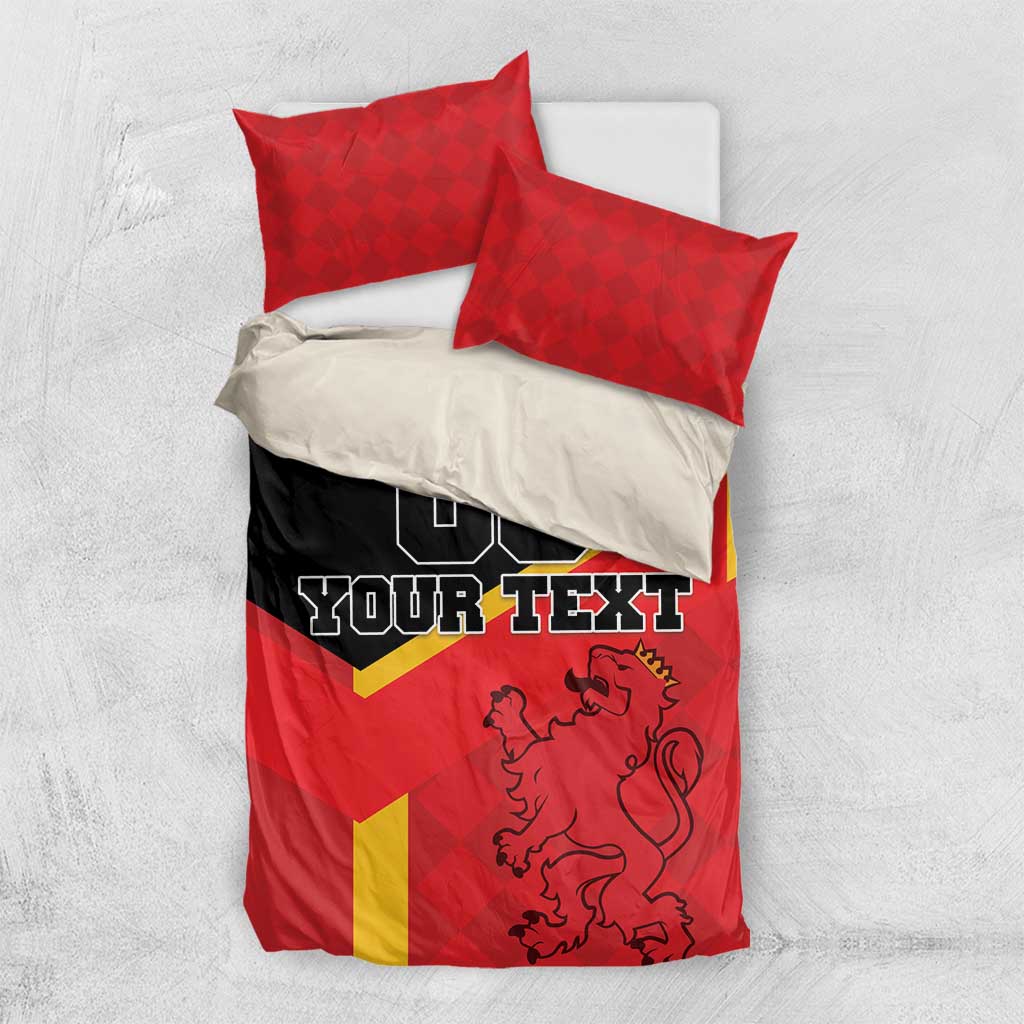 Red Spain bedding set with yellow diagonal stripe, lion crest, and two red pillowcases on bed.