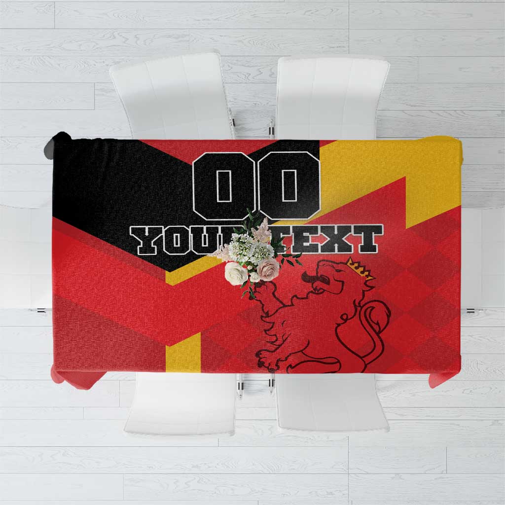Red and yellow Spain tablecloth with black crest and bold black graphic text panel