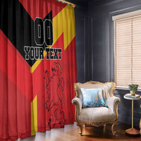 Red window curtain with black and gold Spain flag design and custom text, lion emblem